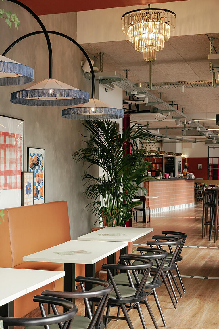Contemporary restaurant interior combining natural materials, custom furniture and sustainable spatial design.