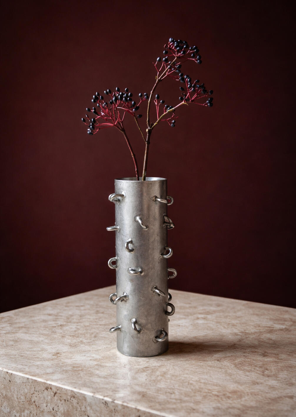 Experimental metal object exploring craftsmanship, stainless steel and sculptural design.