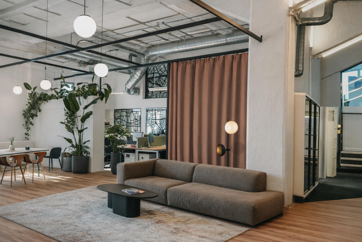 Interior architecture project creating a collaborative workspace with bespoke furniture and warm materials.
